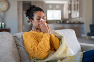 woman sneezing
