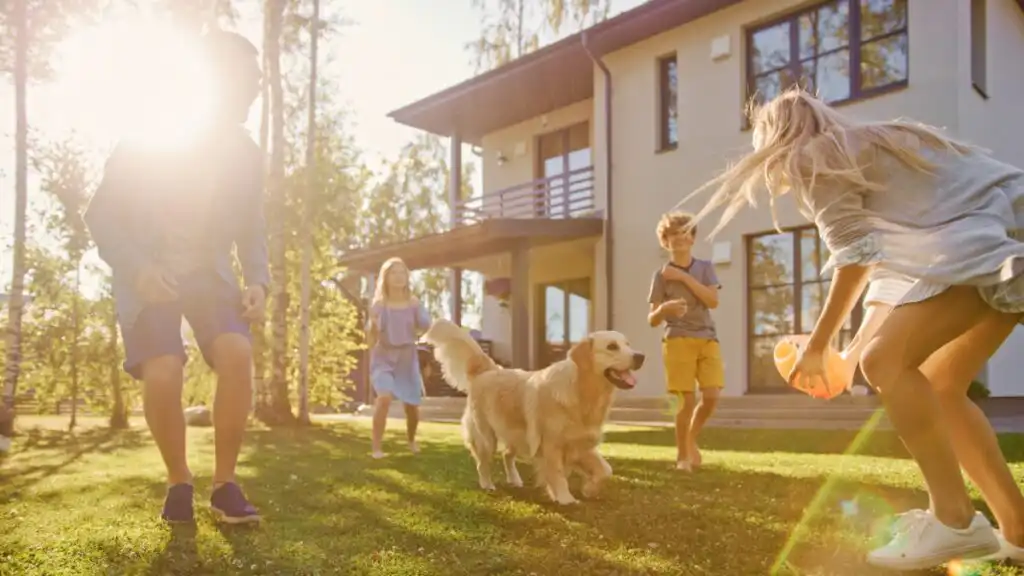 Family enjoying time at home with their dog and local cleaning professionals.